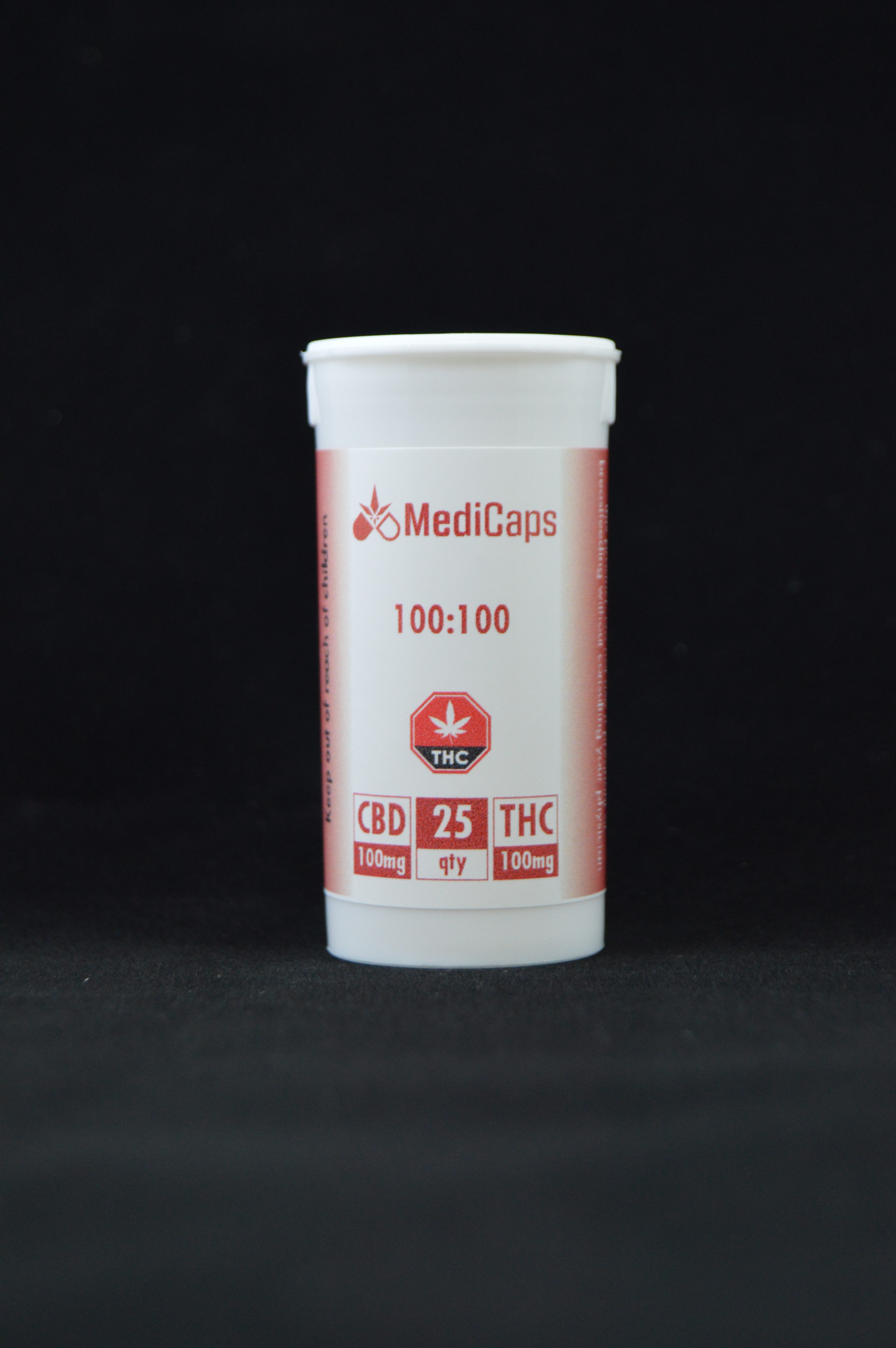 100:100 CBD:THC Capsule - 25 Bottle image with a close-up shot