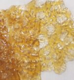 White Fire OG Shatter, amber in color with a glass-like consistency.